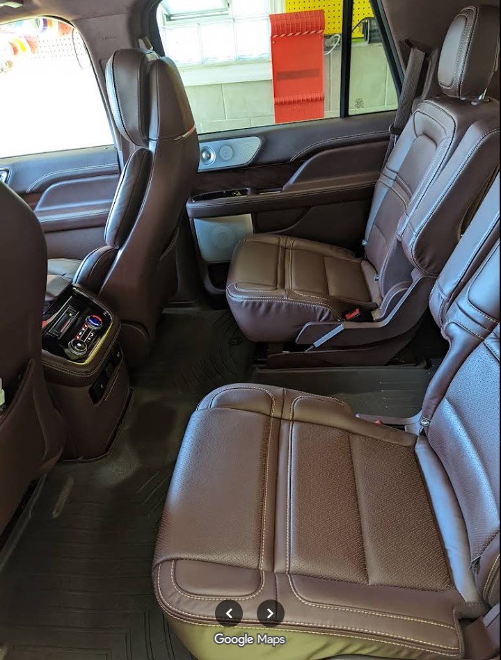 Conditioned brown leather SUV interior after a full detail