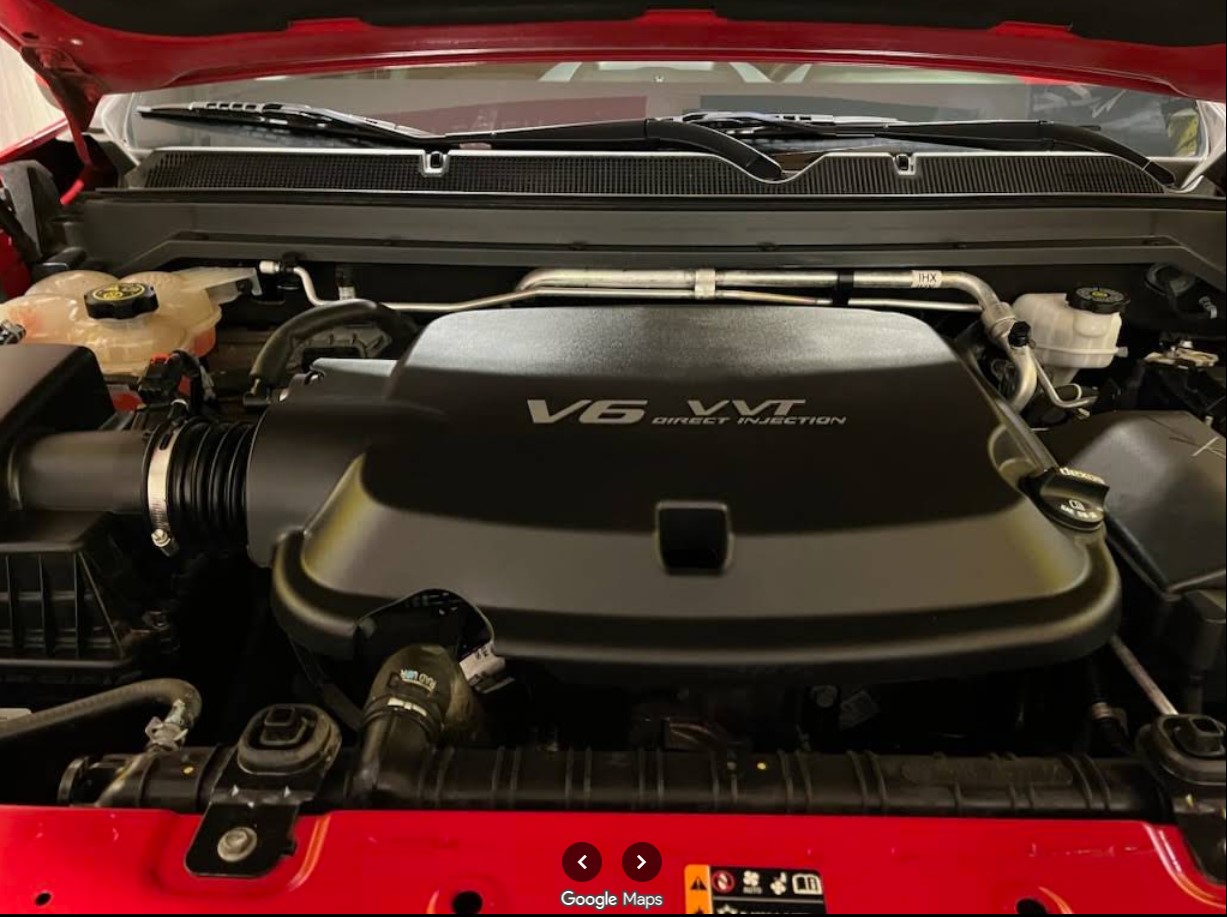 V6 engine bay of a red truck after engine cleaning